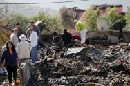 Israeli politicians and the local residents surveying the damages from the fires in Neve Tzuf