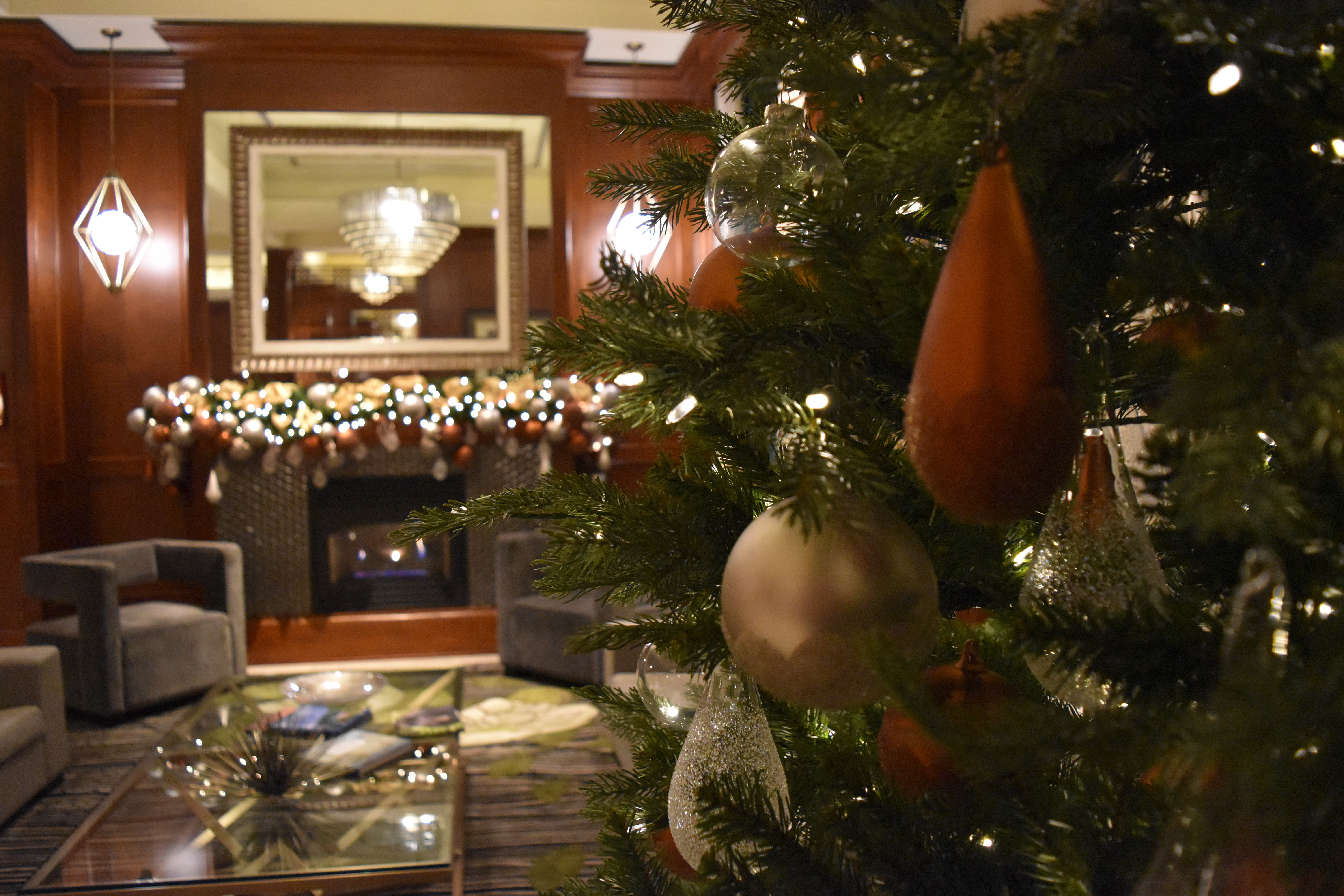 Christmas Lobby 2017 tree with fireplace dim lighting 2
