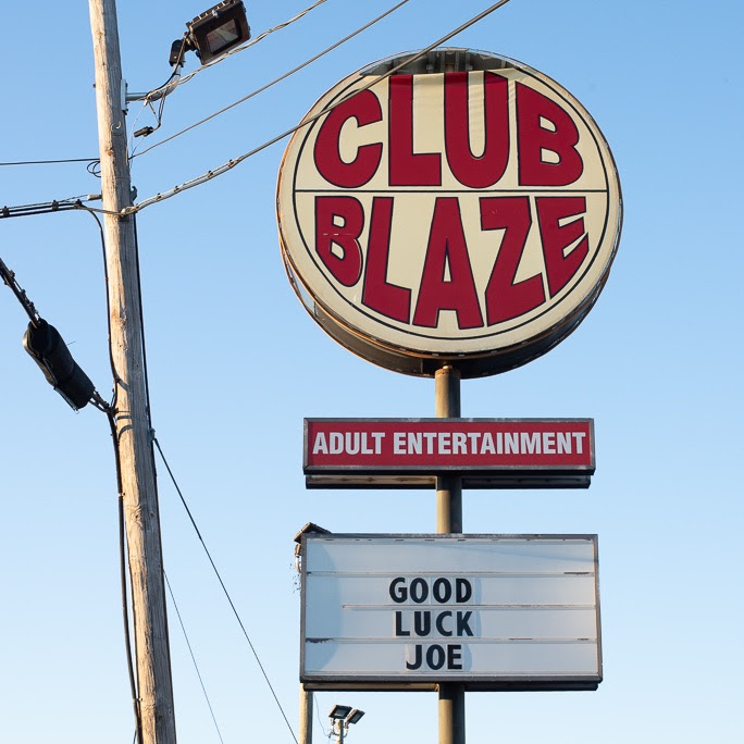 a marquee sign that says CLUB BLAZE and GOOD LUCK JOE