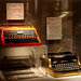 Two 1950s models, an Underwood and a gold-plated Royal, are among the typewriters in an exhibition at the New Britain Museum of American Art.