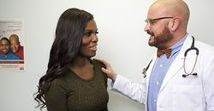 image of a doctor talking with a transgendered patient