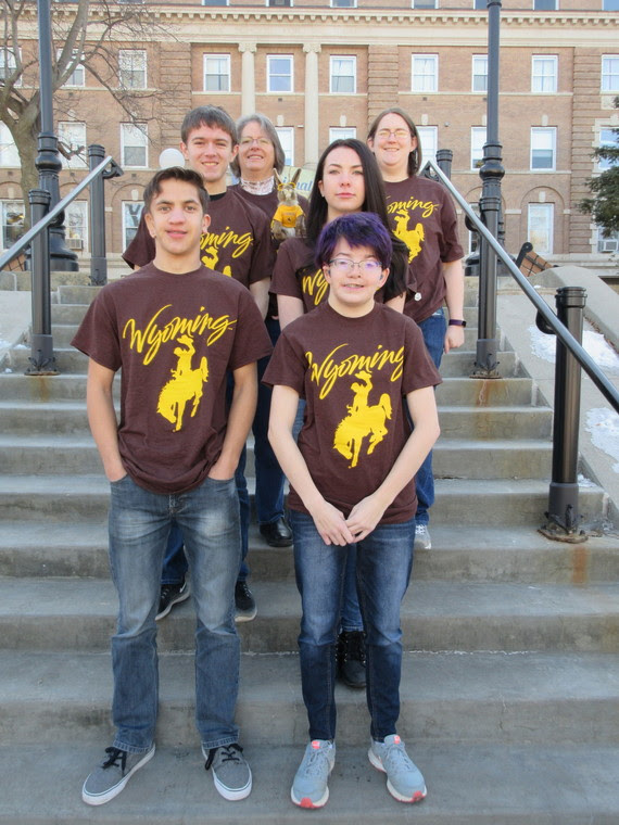 The four Wyoming students that make up the Academic Bowl team stand with their coaches on the steps outside the Iowa School for the Deaf.