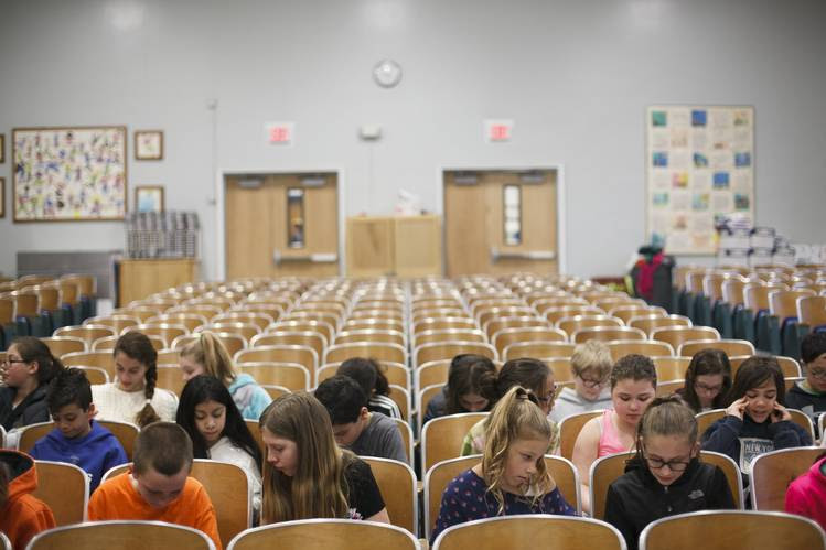 Students who are opting out of the state tests sit in the auditorium of William S. Covert Elementary School.