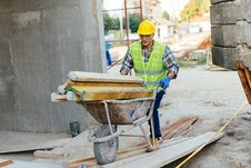 construction worker on site undertaking manual handling activity