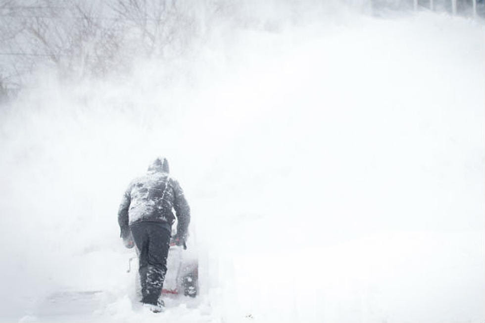 Person plowing snow