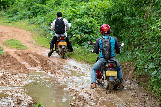 Men driving motorbikes