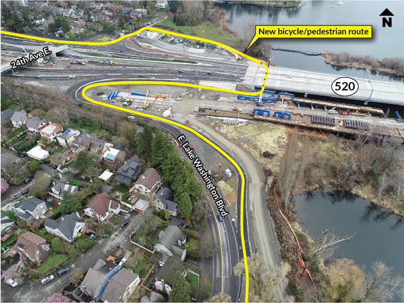 An aerial view of SR 520 in Montlake. There is a yellow line labeled new bicycle pedestrian route under the highway.