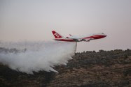 The 747 Supertanker helps to extinguish a fire on November 26, 2016.