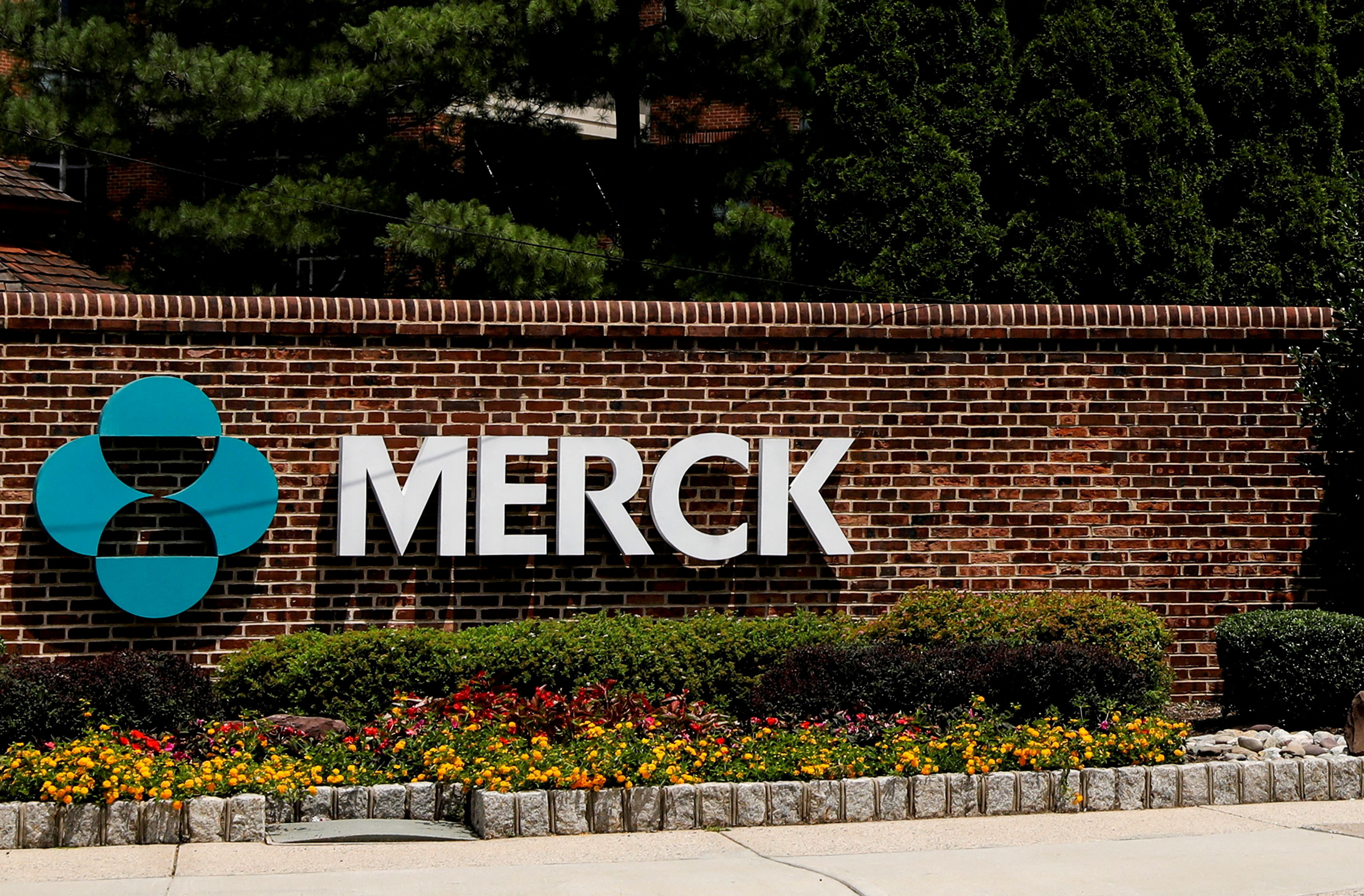 FILE PHOTO: The Merck logo is seen at a gate to the Merck & Co campus in Rahway, New Jersey, New Jersey