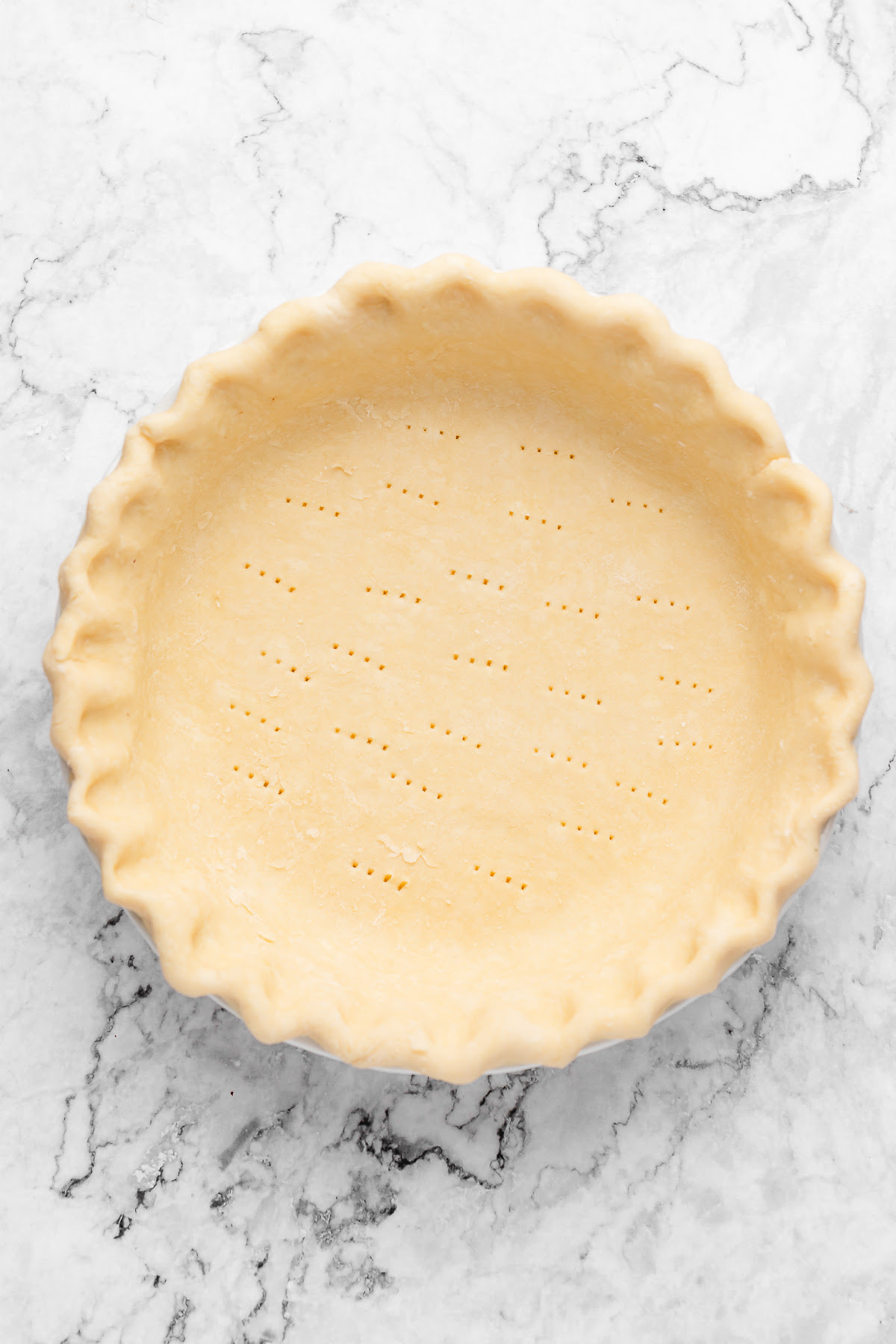 This Vegan Sweet Potato Pie is just like the Southern classic, but made without the dairy and eggs. Sweet, creamy, and perfect! Pie crust in pan