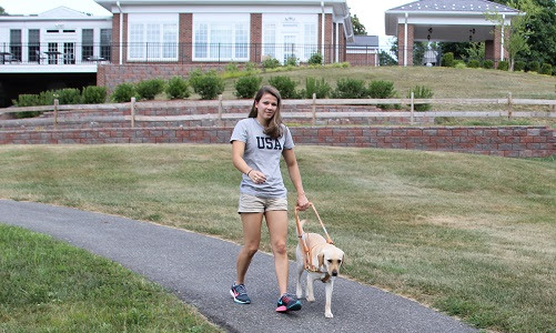 Becca Myers and Birdie on campus