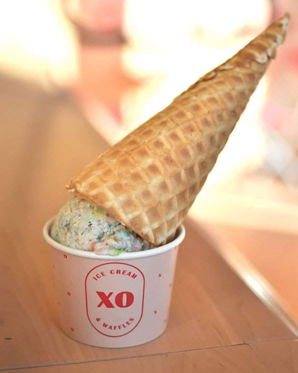XO Ice Cream dish with an upside down cone with ice cream sitting inside