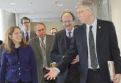 HHS secretary Burwell walks in Clinical Center hallway with NIH Dir Collins NCI Dir Varmus and NIH Deputy Dir Tabak