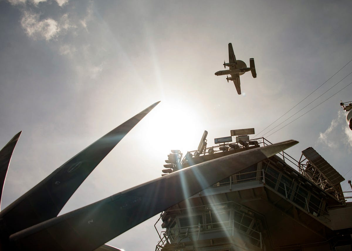 Airborne early warning and control planes like the E-2 Hawkeye use massive radars to act as the eyes and ears of the fleet. Not much gets past them.