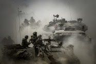 Israeli soldiers seen on tanks at an IDF staging area near the Israeli border with Gaza, on July 31, 2014.