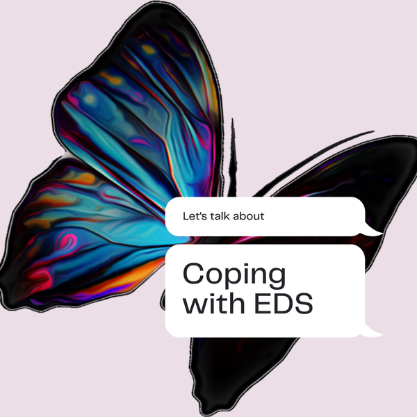 A colorful butterfly in the background. Text: Coping with EDS