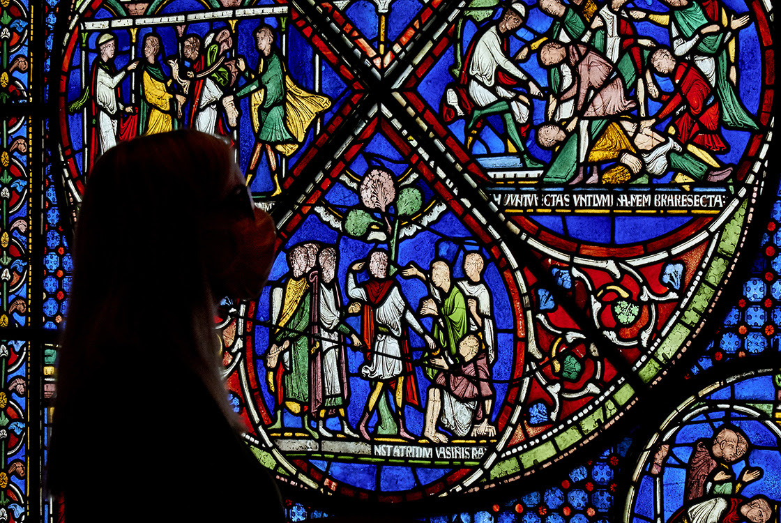 The Miracle Window in the Becket Exhibition with a person in front