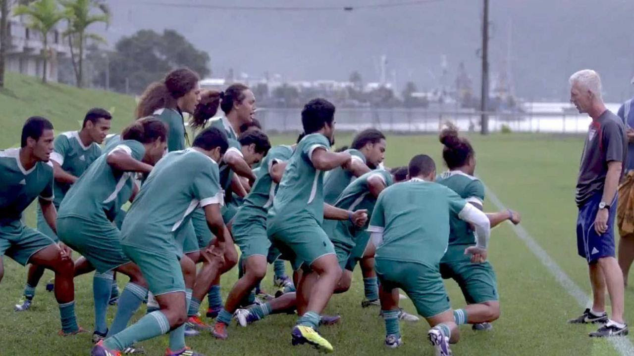 The US Samoa football team crashing into a heap