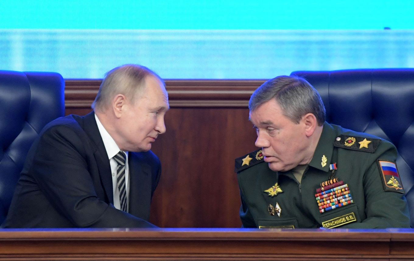 Russian President Vladimir Putin and Gen. Valery Gerasimov attend a Defense Ministry meeting in Moscow. (Sergei Guneyev/Sputnik/AFP/Getty Images)