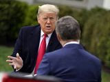President Donald Trump speaks with Fox News Channel Anchor Bill Hemmer during a Fox News Channel virtual town hall, at the White House, Tuesday, March 24, 2020, in Washington. (AP Photo/Evan Vucci)