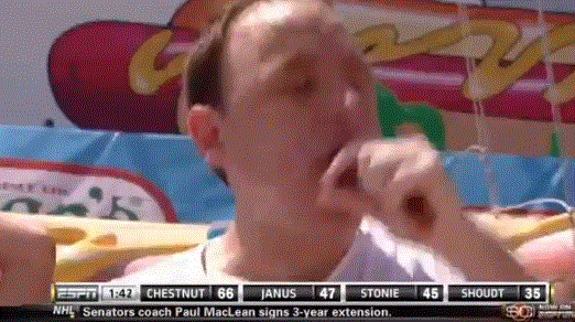 GIF of a man really not enjoying the hot dog eating competition