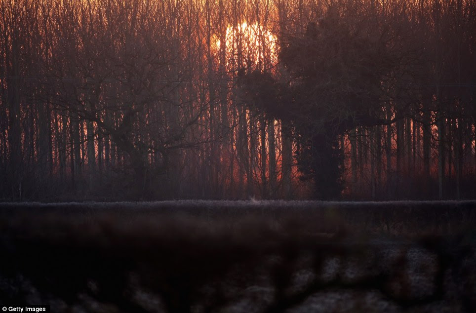 The sun rises and begins to burn off early morning frost clinging to the countryside in Knutsford, Cheshire