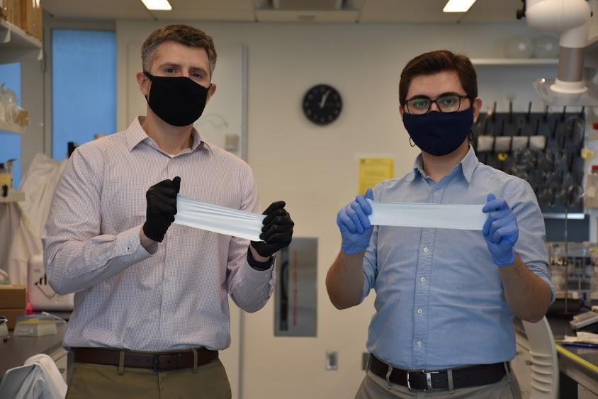 Daniel Roxbury (left) and Mohammad Moein Safaee with pieces of the smart bandage material