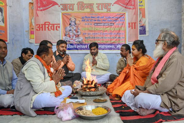 Pooja Shakun Pandey, second from right, during a ceremony worshiping Mr. Godse in Meerut.