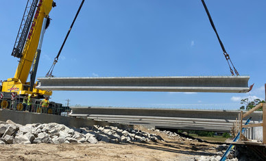 Crane lifting bridge beams