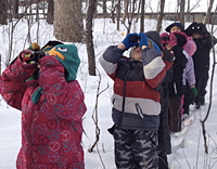 Children looking through binoculars by Susan Hobart