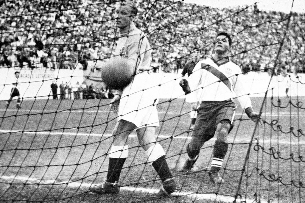 Gaetjens scoring the first, only and winning goal during England's 1950 World Cup match against the US. British goalkeeper Bert Williams (r) watches the ball sail past him.