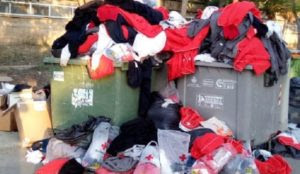 Aquarius migrants in Spain throw away towels and clothes given by the Red Cross