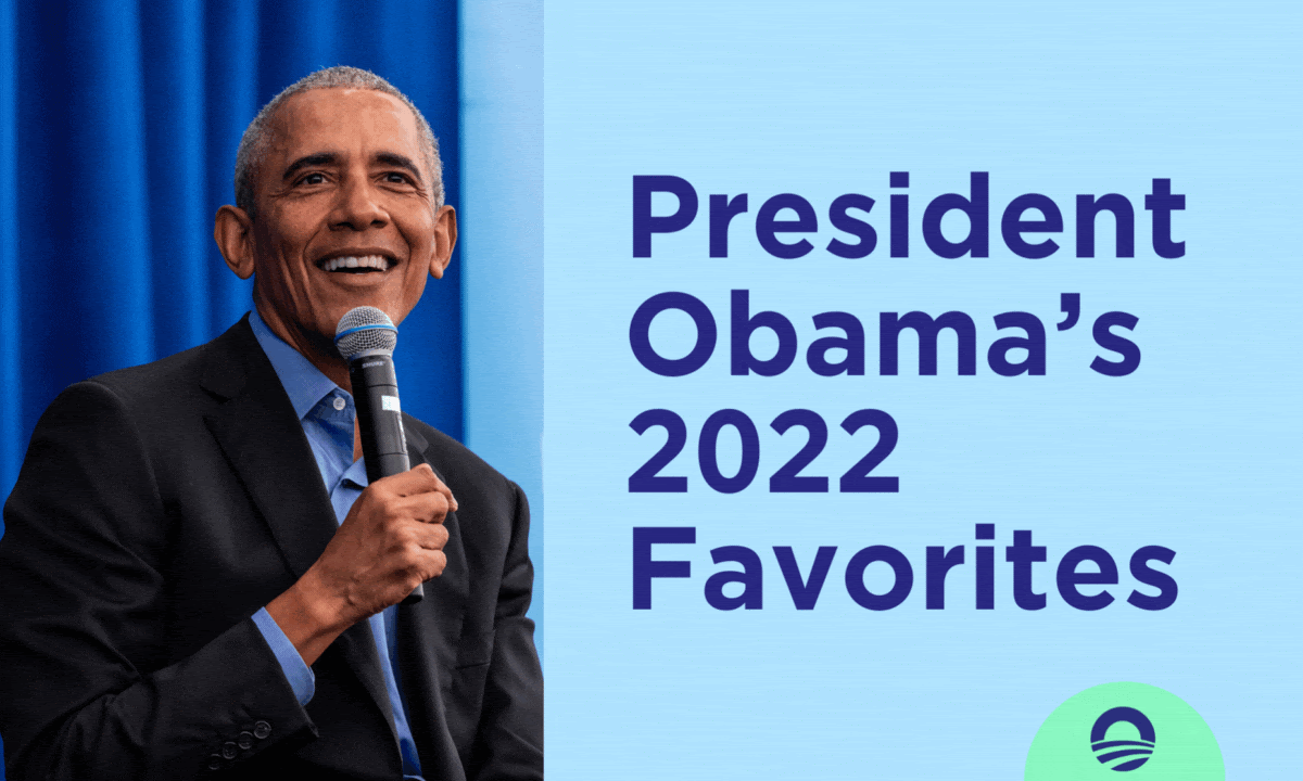 President Obama smiles broadly, holding a microphone up to his mouth with his right hand. He wears a dark suit jacket and a blue collared shirt. “President Obama’s 2022 Favorites” is written in navy lettering against a sky blue background. A thin, mint circle animates around “2022.”