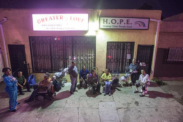 Charles on the wheel chair, Daphne wearing blue, Paloma, Hilda, and Nora sitting at the center, 11165 S. Central Ave., LA, 2014