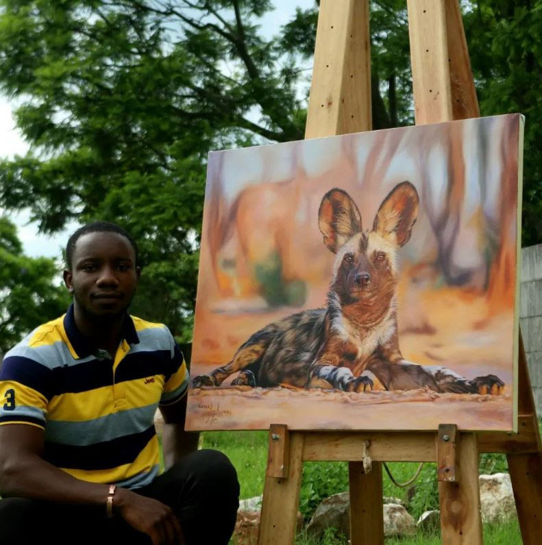 Painting of an African wild dog pictured with the ARTIST COPYRIGHT Carrel Kumbirai